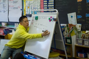 Third grade teacher Wilson Lew walks his students through a weekly session on dealing with conflict and emotion - much like the monthly session held for parents.