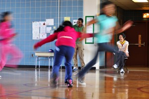 Children play "flag tag" inside the gymnasium at P.S. 24 in Brooklyn. 