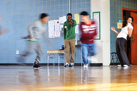 Children play "flag tag" inside the gymnasium at P.S. 24 in Brooklyn.