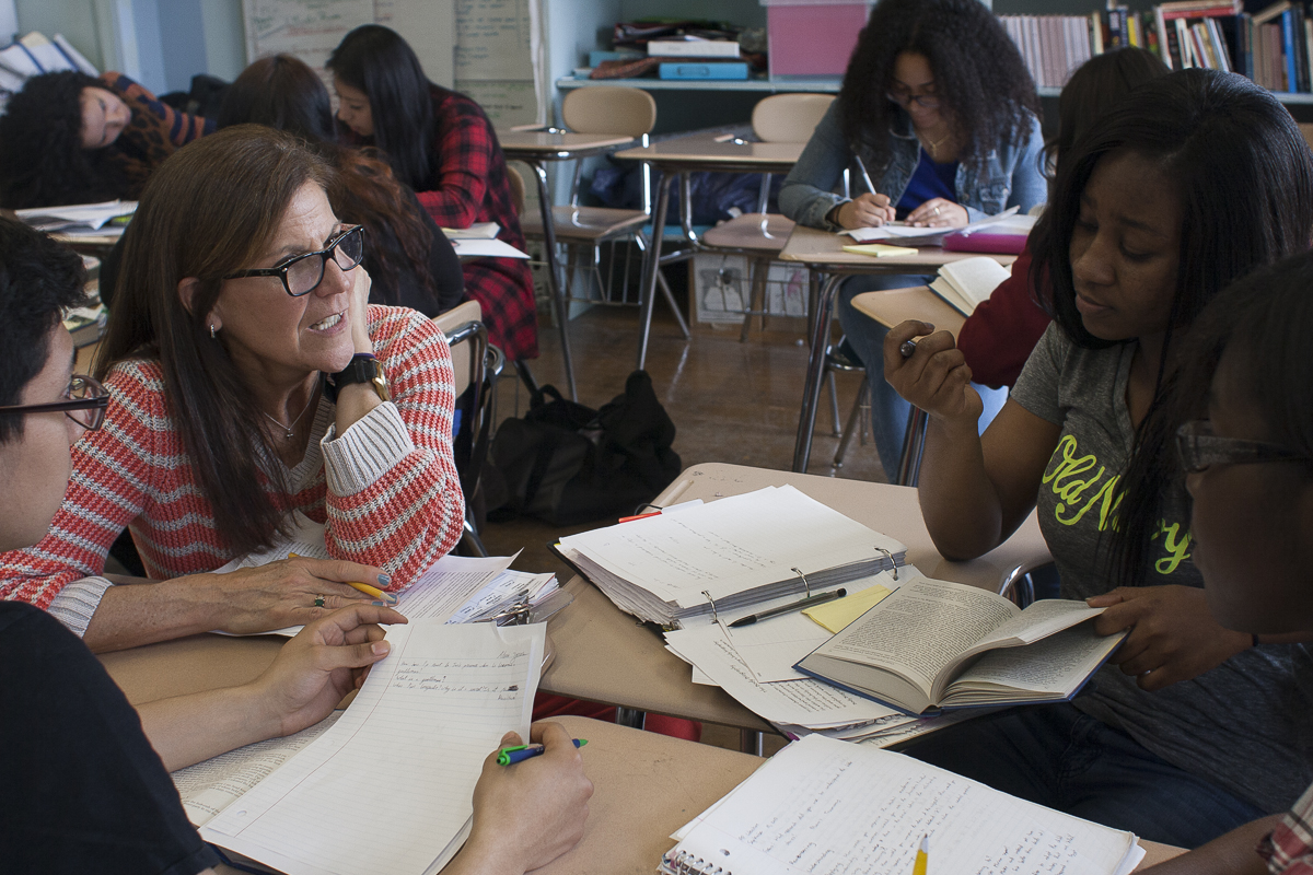 Ann Neary works in small groups during an Advanced Placement English class at DeWitt Clinton High School in the Bronx on April 7, 2014.