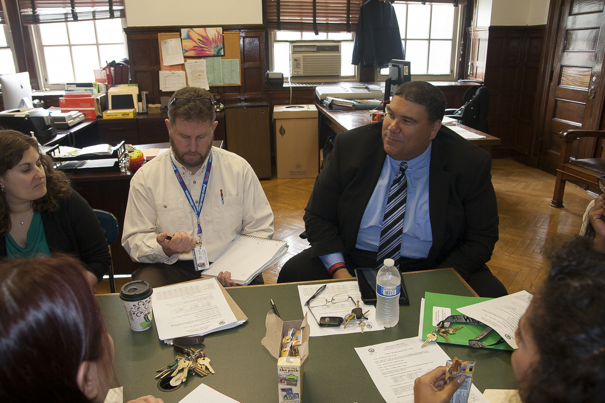 Principal Santiago Taveras meets with assistant principals and other administrators at DeWitt Clinton High School on May 1, 2014 to discuss enrollment in his flagship learning communities which will group the student body in subject-specific houses. The program is set to launch next year, but with less than two months of school left, less than half of upperclassmen have registered for a house.