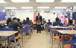 Derrick Harrison holds the attention of his 6th grade math students. 