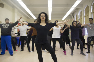 Exenia Rocco demonstrates to her Latin dance class how her choreography is suppose to look like when done with feeling.