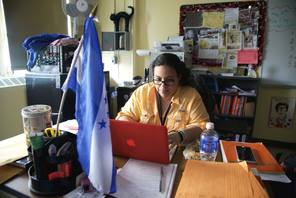 JoMarie Figueroa works at her laptop in her classroom.