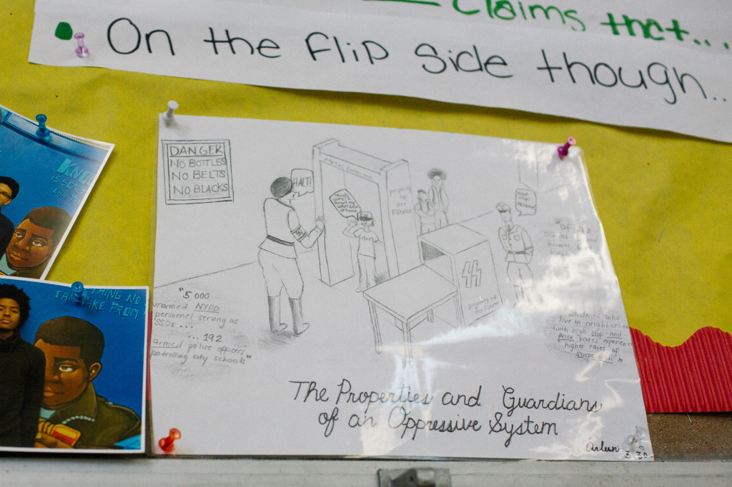 A cartoon drawn by a Collegiate student depicting the school scanner hangs in the social studies classroom. (CREDIT: Cassandra Giraldo)