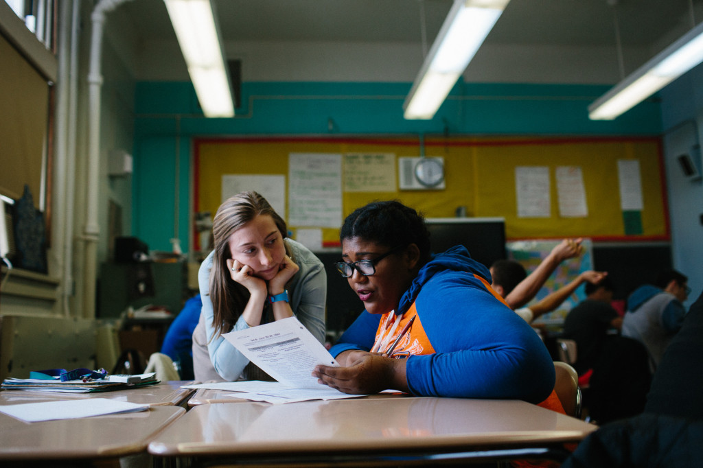 February 10, 2016: Park Slope Collegiate junior Kastia Colon, 17, works with her social studies teacher Julia Konrad after a class debate on societal reform. Colon is determined to see the school mural go up before she graduates this spring. (CREDIT: Cassandra Giraldo)