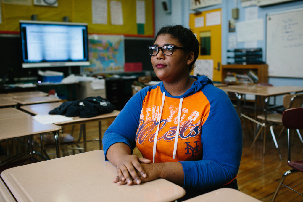 February 10, 2016: Park Slope Collegiate senior Kastia Colon, 17, sits at her desk in social studies class after a class debate on societal reform. Colon is determined to see the school mural go up before she graduates this spring. (CREDIT: Cassandra Giraldo)